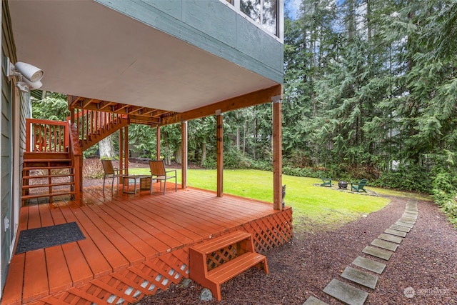 wooden deck with a lawn