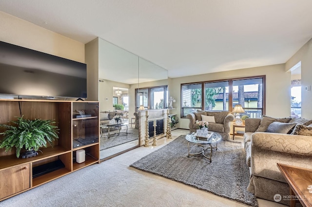 carpeted living room featuring a high end fireplace