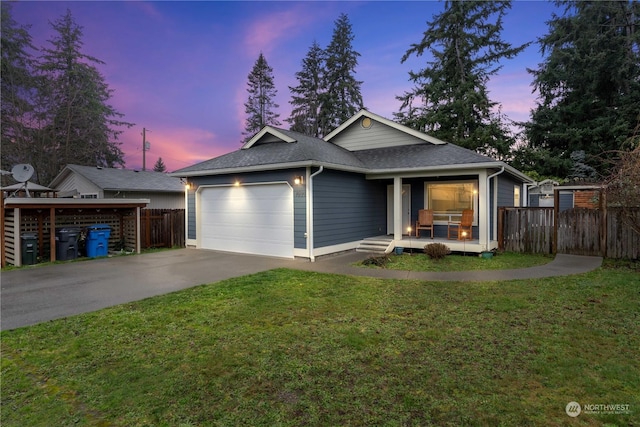 view of front of property with a lawn and a garage