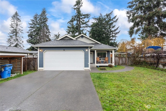 view of front of house with a porch, a garage, and a front yard