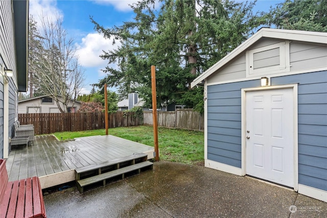 wooden deck featuring a yard