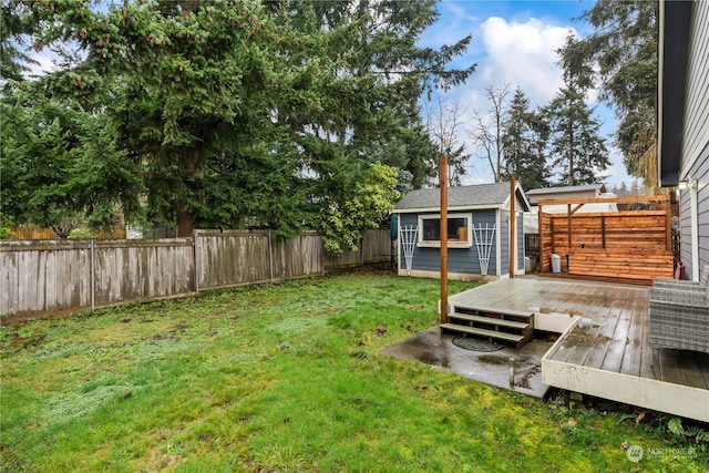 view of yard with an outbuilding and a deck