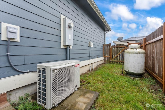 view of side of property with ac unit