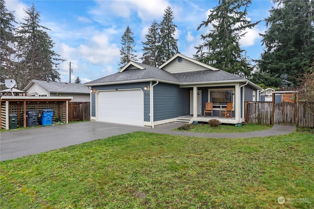 view of front of home featuring a garage and a front yard