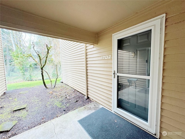 property entrance with a patio