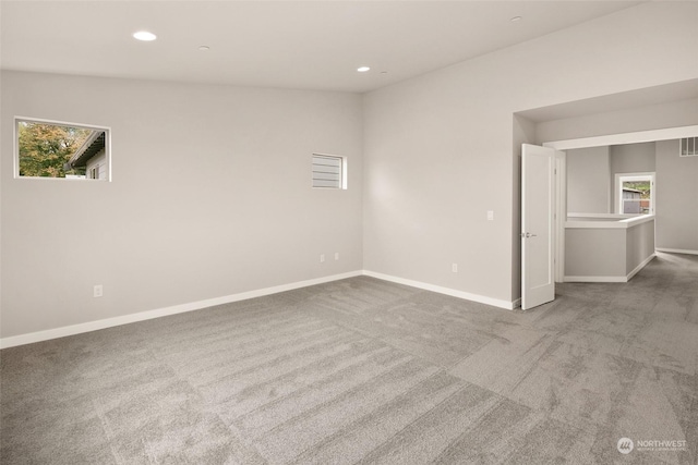 empty room featuring light carpet