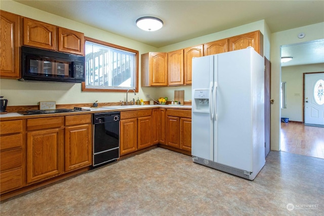 45143 Main St, Concrete, WA 98237 - kitchen with black appliances, a healthy amount of sunlight, and sink