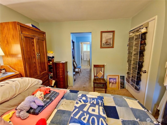 carpeted bedroom with a closet