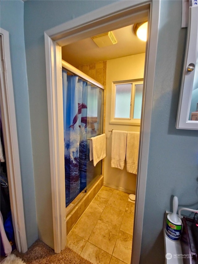 bathroom featuring walk in shower