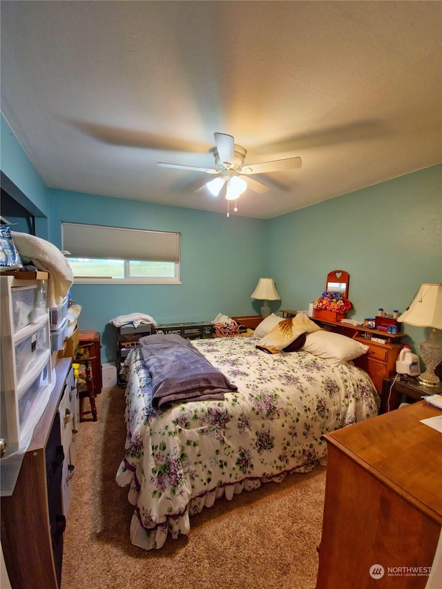 bedroom with ceiling fan and carpet floors