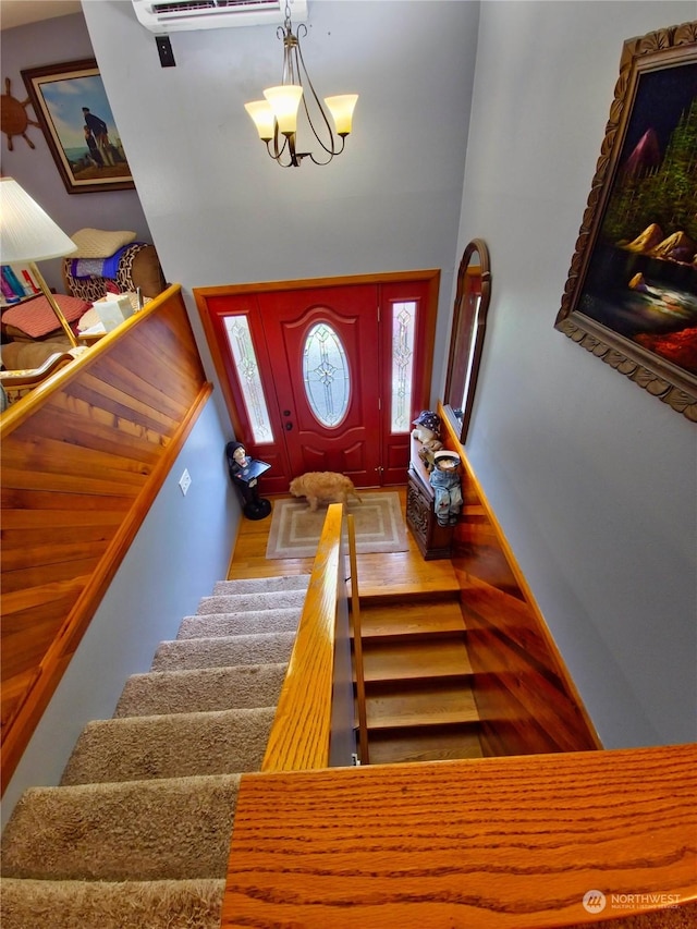 interior space with a chandelier and hardwood / wood-style flooring