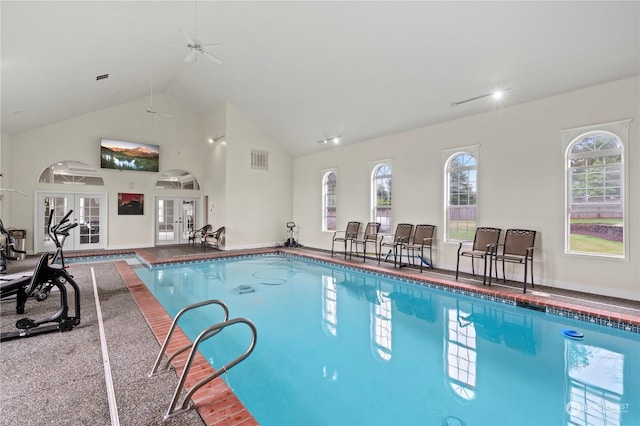 view of pool featuring ceiling fan and french doors