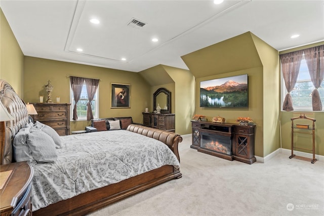 bedroom featuring light colored carpet