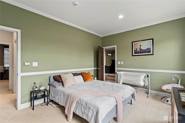 carpeted bedroom with ornamental molding