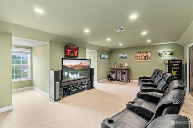 carpeted living room with vaulted ceiling