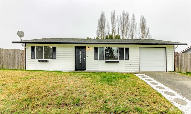 single story home featuring a garage and a front yard