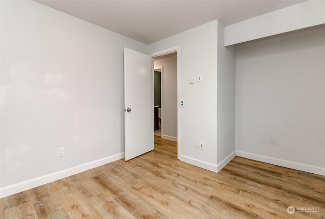 empty room featuring hardwood / wood-style flooring