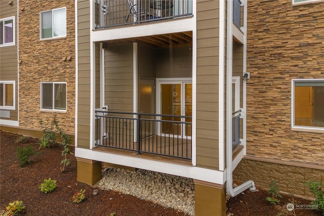 doorway to property featuring a balcony