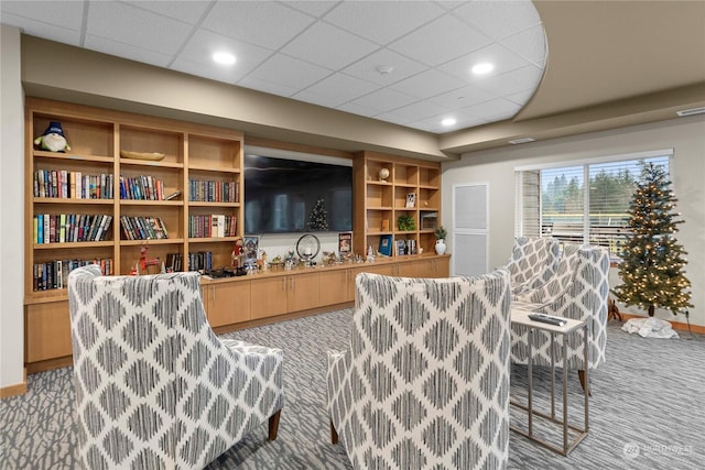 bar with light colored carpet and a drop ceiling