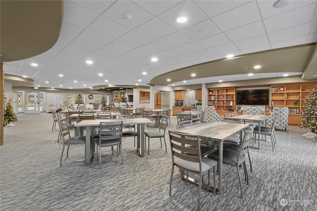 dining space featuring carpet flooring