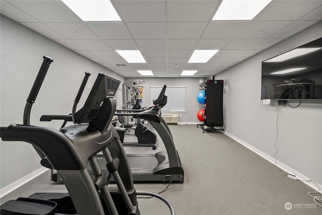 workout room featuring a drop ceiling