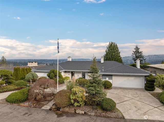 single story home featuring a garage