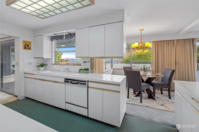 4144 94th Ave SE, Mercer Island, WA 98040 - kitchen with decorative light fixtures, sink, white cabinets, and dishwasher