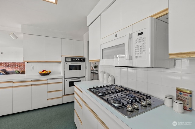 4144 94th Ave SE, Mercer Island, WA 98040 - kitchen with tasteful backsplash, white appliances, and white cabinetry