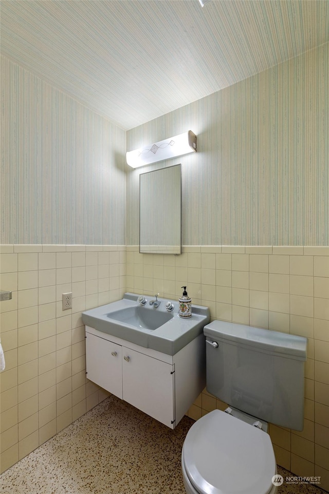 4144 94th Ave SE, Mercer Island, WA 98040 - bathroom with toilet, vanity, and tile walls