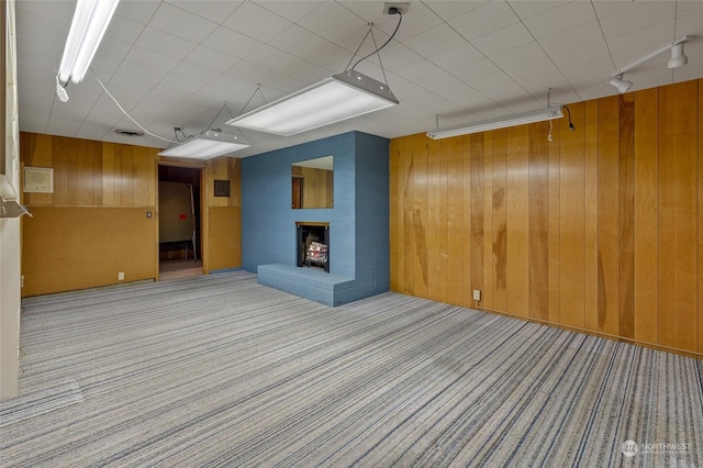 4144 94th Ave SE, Mercer Island, WA 98040 - basement featuring a large fireplace, light carpet, and wooden walls
