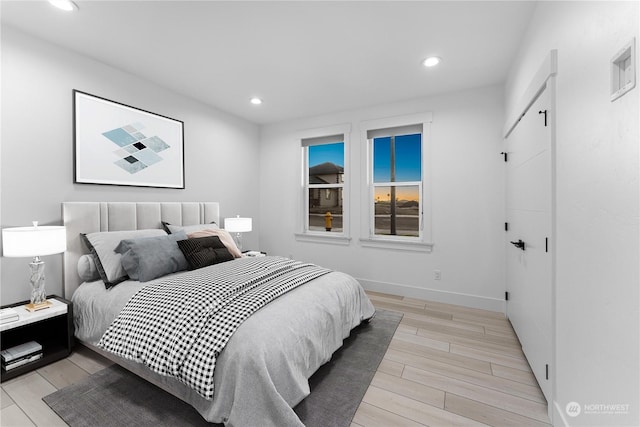 bedroom featuring light wood-type flooring