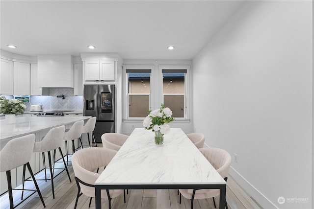 dining room featuring light hardwood / wood-style flooring