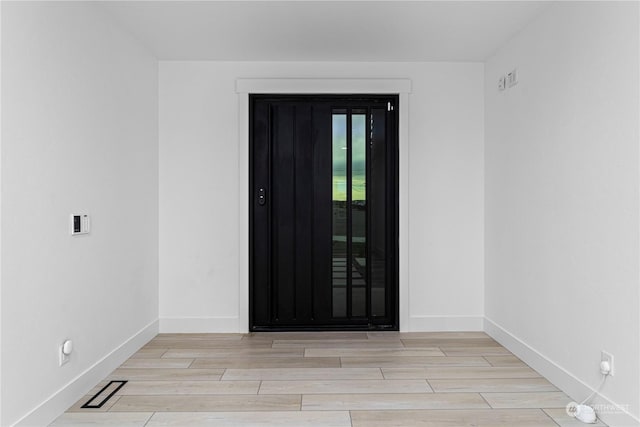 entrance foyer with light wood-type flooring