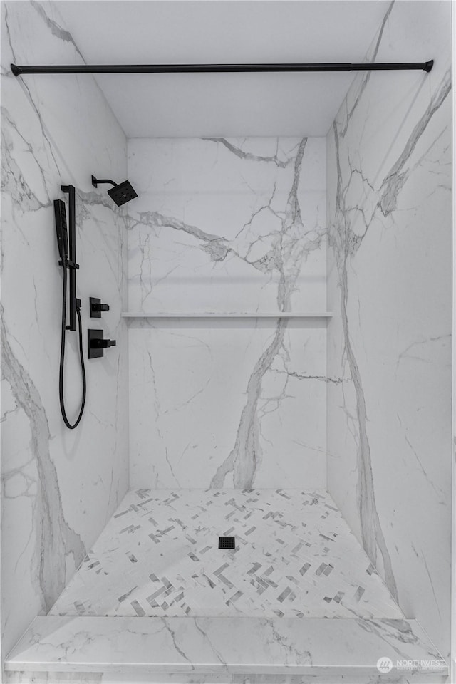 interior space with a tile shower