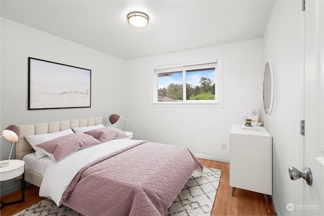 bedroom with light wood-type flooring