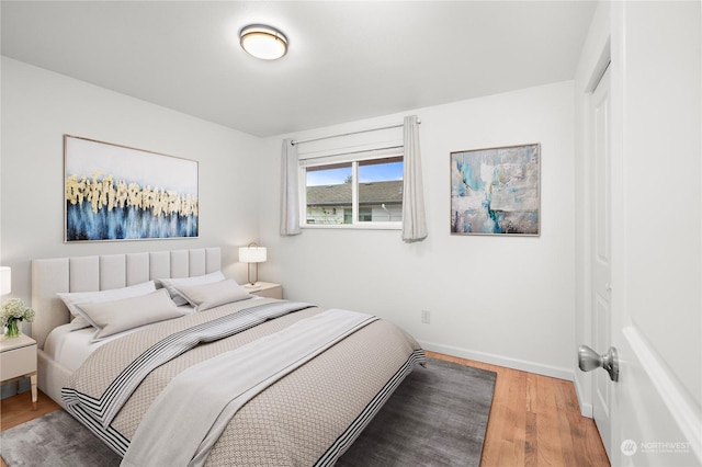 bedroom with wood-type flooring