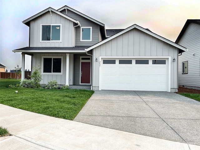 view of front of property with a front lawn and a garage