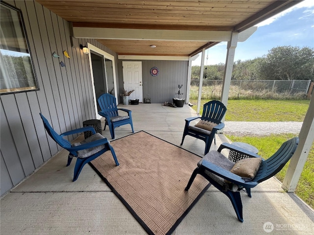 view of patio / terrace featuring fence