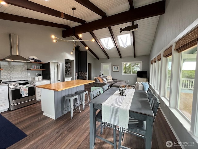 dining room with dark wood-type flooring, a skylight, and beam ceiling