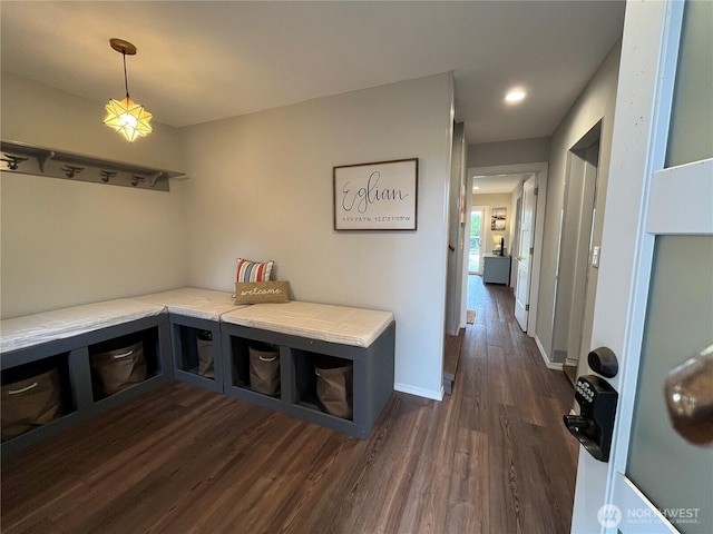 mudroom with dark wood-style floors and baseboards