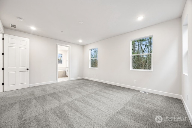 empty room with light colored carpet