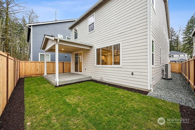 rear view of property with a patio area and a yard