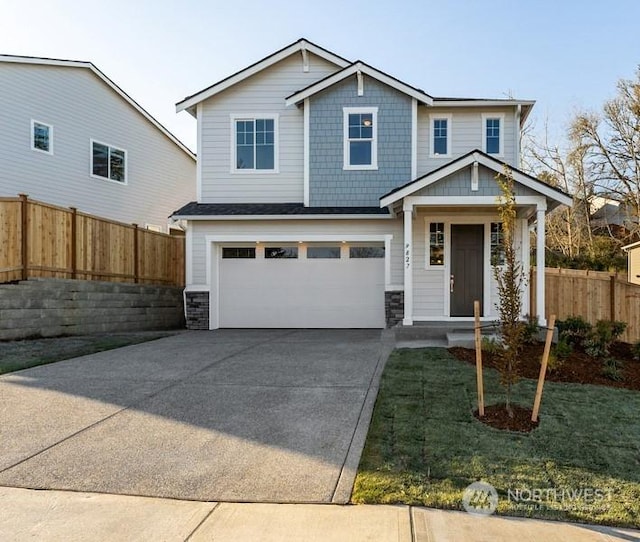 view of front of home featuring a front lawn and a garage