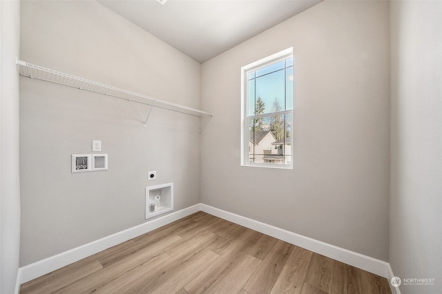 laundry room featuring light hardwood / wood-style floors, washer hookup, and hookup for an electric dryer