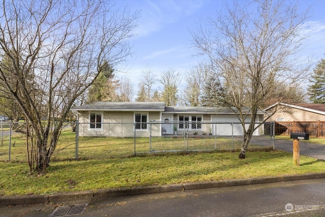 ranch-style home featuring a front yard and a garage