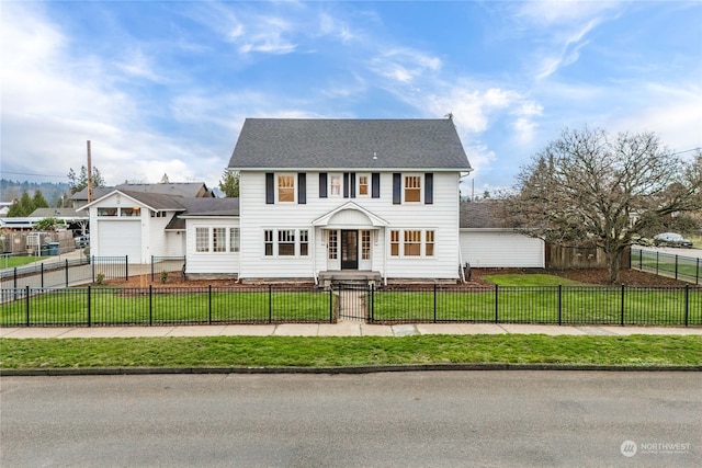 colonial home featuring a front yard