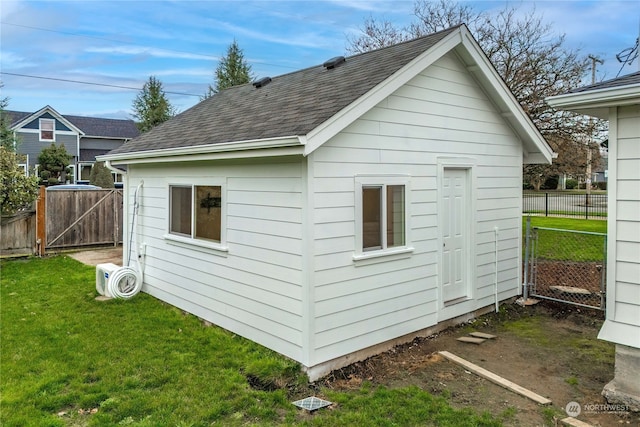 view of outdoor structure with a lawn