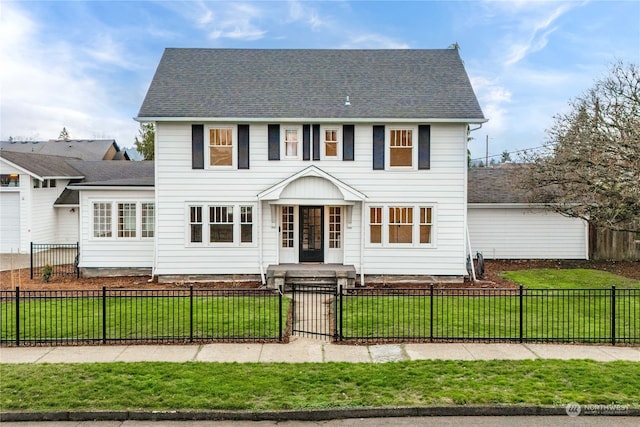 colonial inspired home featuring a front yard