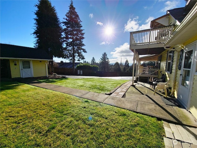 view of yard with a balcony and a water view