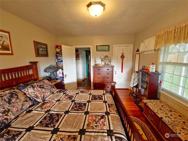 bedroom with hardwood / wood-style floors